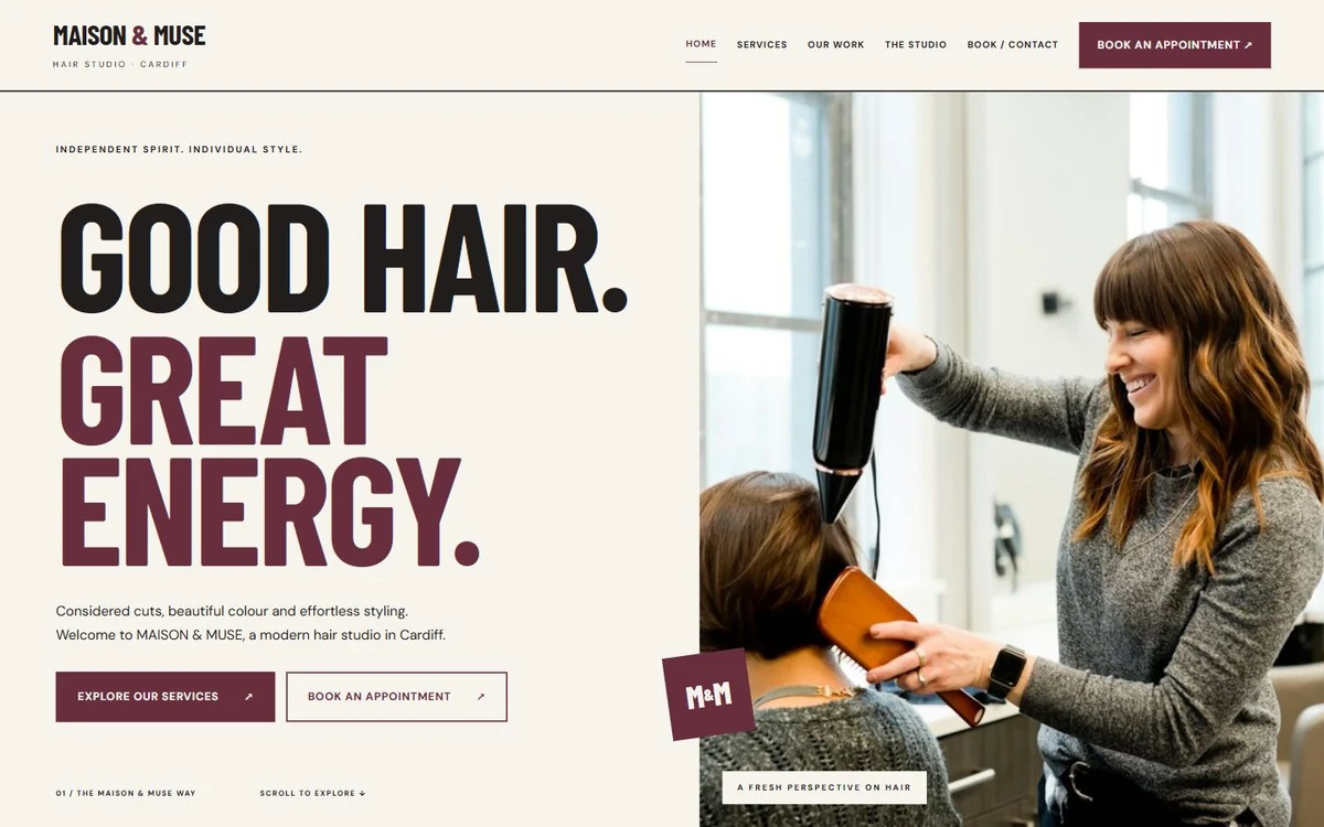MAISON and MUSE desktop homepage with burgundy editorial typography, Good hair. Great energy. headline and salon photography.